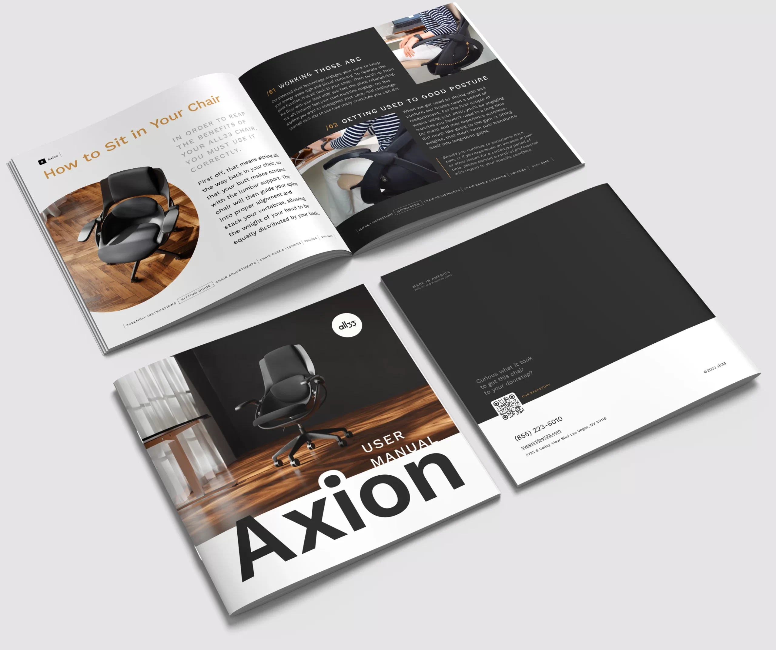 Top-down view of Axion user manuals: one closed showing a clean cover with the Axion chair photo and large “Axion” title; one open to a spread titled “How to Sit in Your Chair” with step-by-step tips, large photos, and callouts; and a back cover with support info and a QR code for help. Square format, minimal black-and-white layout with warm accents; this booklet ships inside a parchment-style envelope in the box.