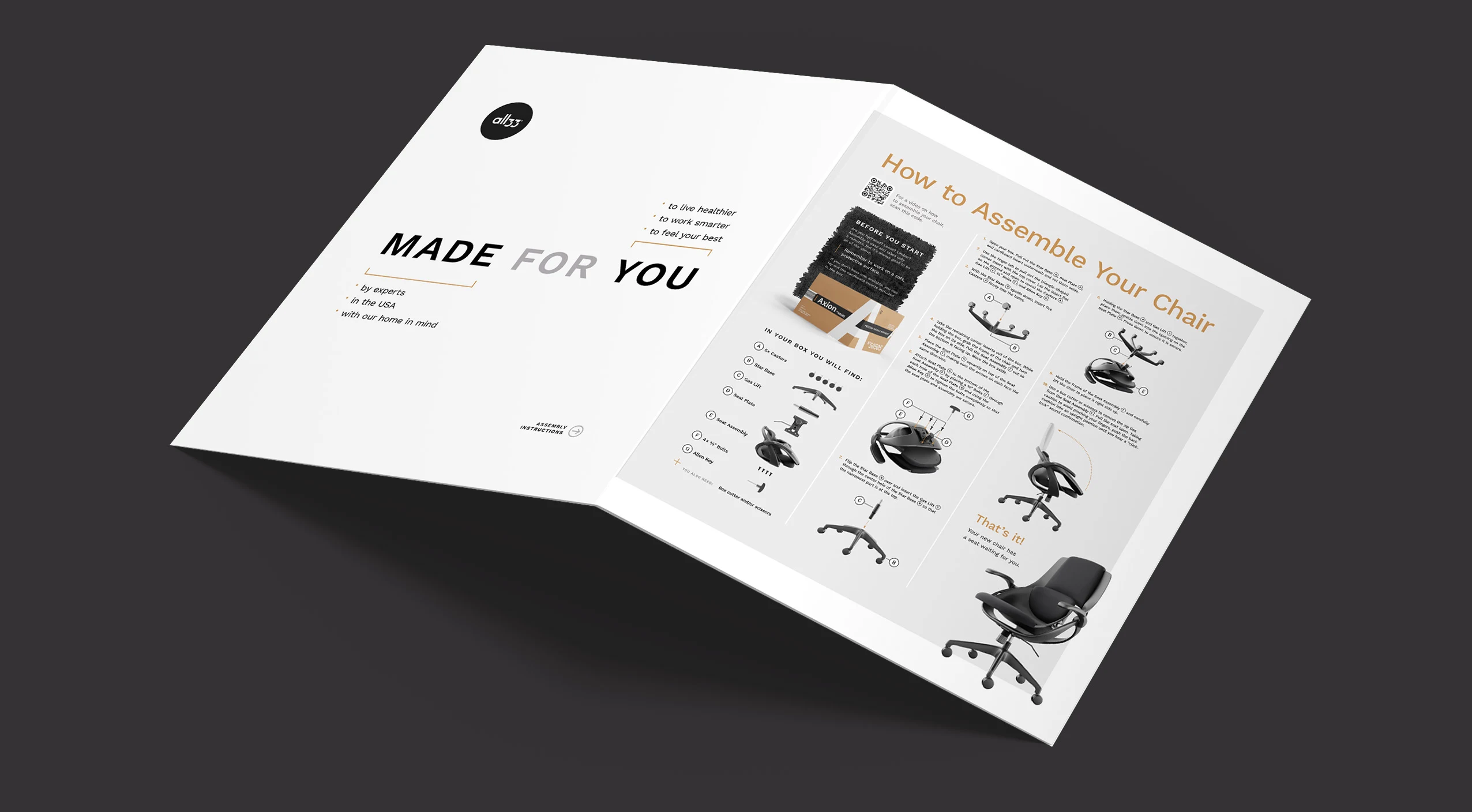 Angled photo of the white insert on a dark surface. Left panel shows the “MADE FOR YOU” headline with short bullets; right panel shows the “How to Assemble Your Chair” layout in columns with big 3D renders and arrows. Clean tan accents tie into the Axion packaging system.