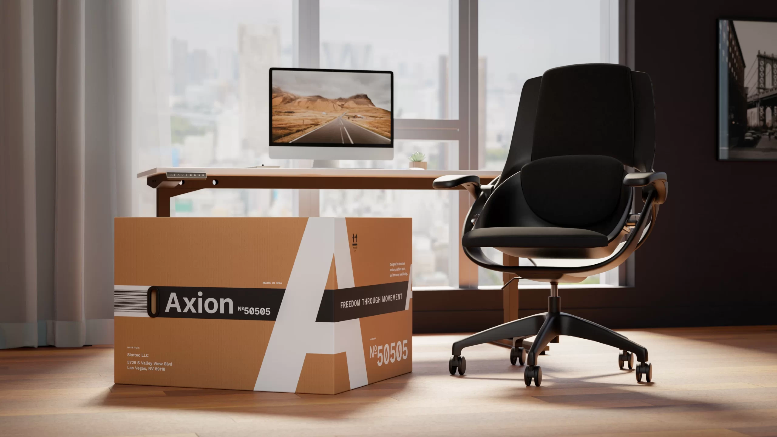The Axion ergonomic chair and its reimagined packaging system, captured in a studio setup. The 5-ply kraft box features a bold wrap-around “A”, black-and-white dual handles, and clean structural typography — designed to move as seamlessly as the product itself.